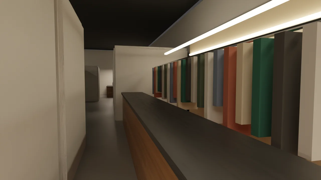The wardrobe counter: a six-metre rail of garments lit from above, behind a dark counter.